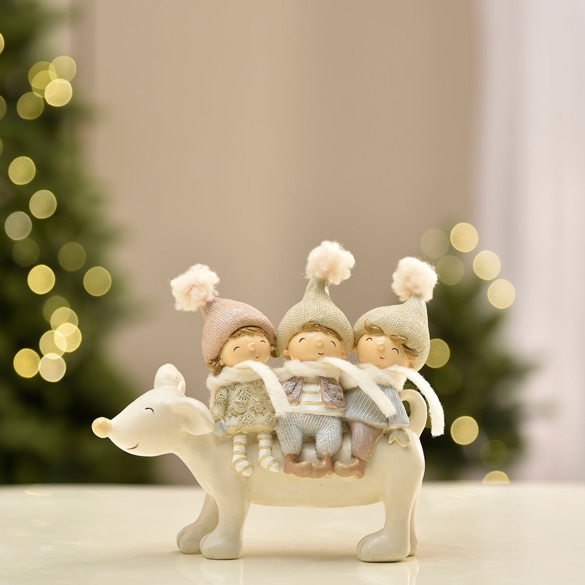 Figurine de Noël 3 Enfants sur renne Pastel